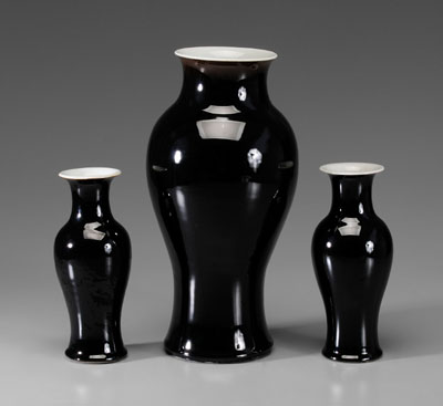 Appraisal: Three Mirror-Black Porcelain Vases Chinese th century baluster forms one