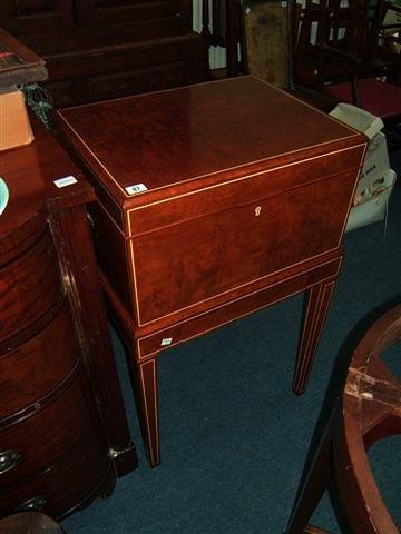 Appraisal: A walnut veneered box on stand with line inlay possibly