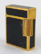 Appraisal: An S T Dupont gold plate and lacquer cigarette lighter