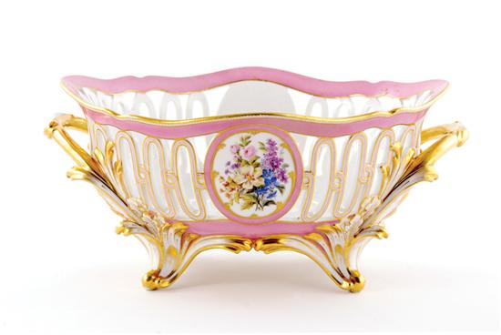 Appraisal: French porcelain centerbowl Lahoche Pannier circa shaped reticulated body inset