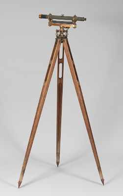 Appraisal: Vintage Surveying Transit With an adjustable wood tripod base with