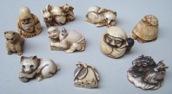 Appraisal: A group of ten ivory netsuke comprising a study of