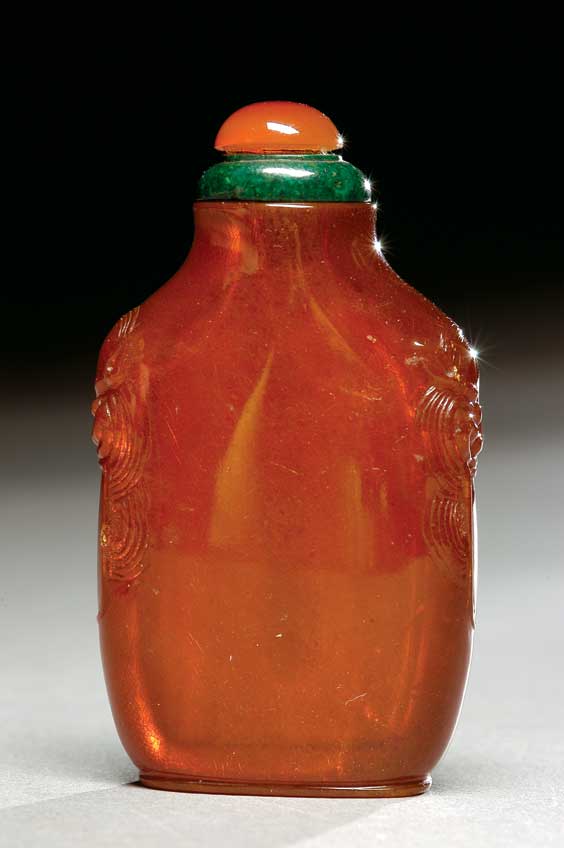 Appraisal: ANTIQUE AMBER SNUFF BOTTLE Finely hollowed and antique carved translucent