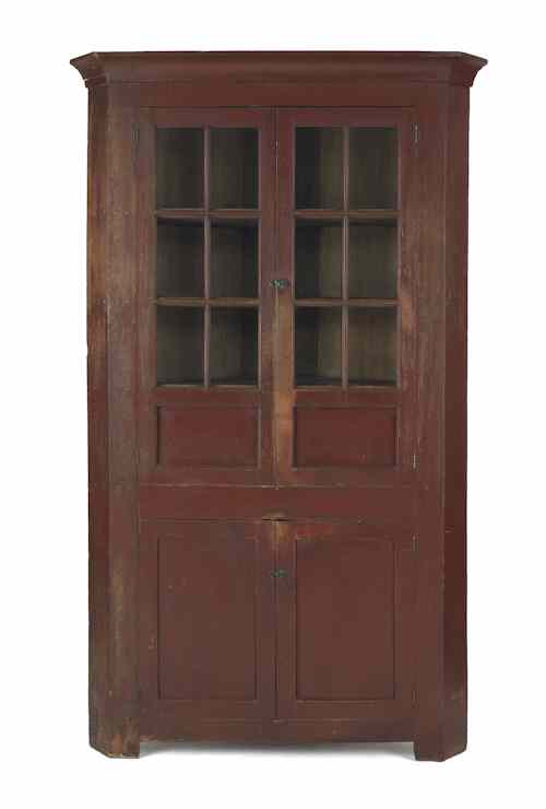 Appraisal: Pennsylvania painted walnut one-piece corner cupboard ca retaining an old