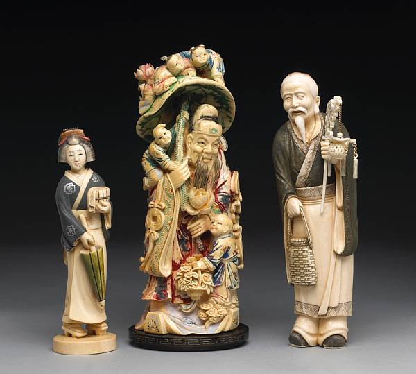 Appraisal: Three tinted ivory figures th Century The first depicting Zhong