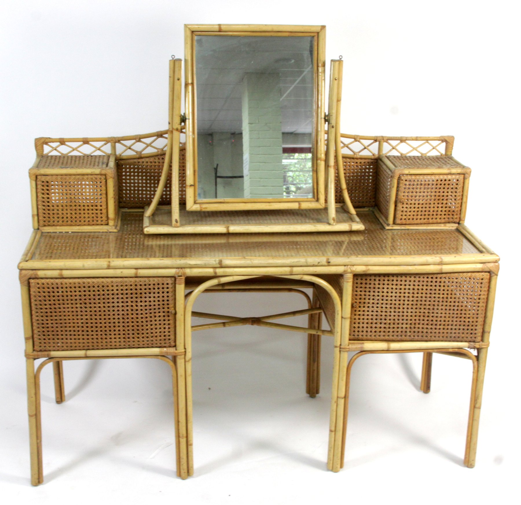 Appraisal: A cane and bamboo dressing table cm wide and a