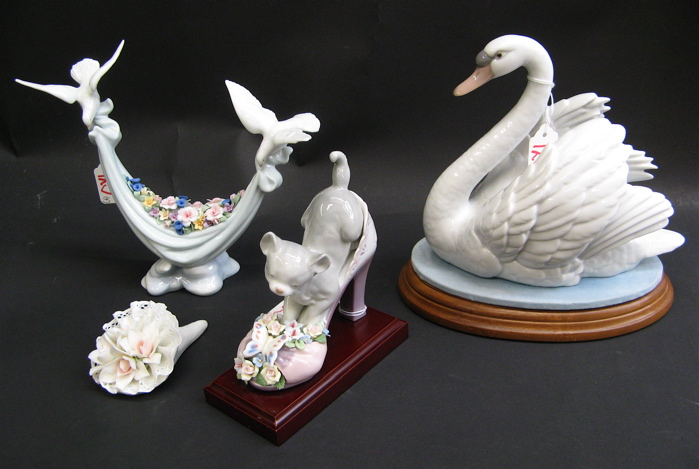 Appraisal: FOUR LLADRO GLAZED PORCELAINS Swan With Spread Wings H plus