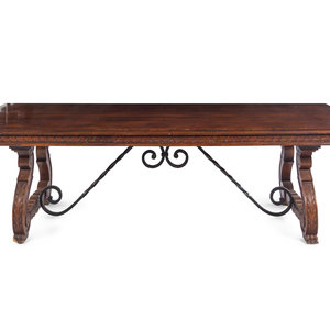 Appraisal: A Spanish Baroque Style Iron-Mounted Walnut and Elm Trestle Table