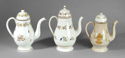 Appraisal: Three pearlware coffeepots one with yellow and brown decoration -