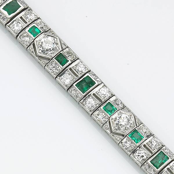 Appraisal: An art deco diamond emerald and platinum bracelet estimated total