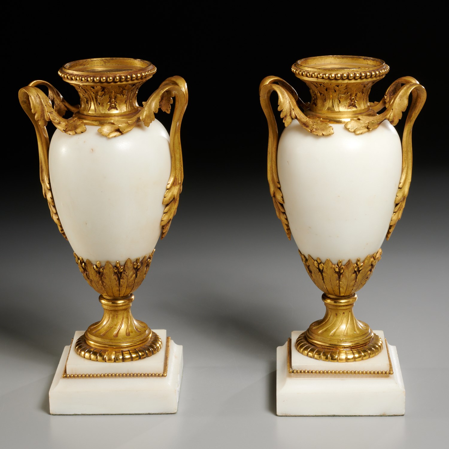 Appraisal: PAIR FRENCH GILT BRONZE MOUNTED MARBLE URNS th c France