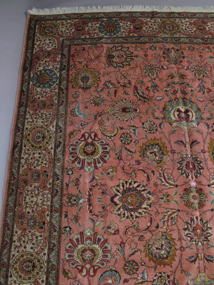 Appraisal: A Tabriz design rug with all over foliate design in