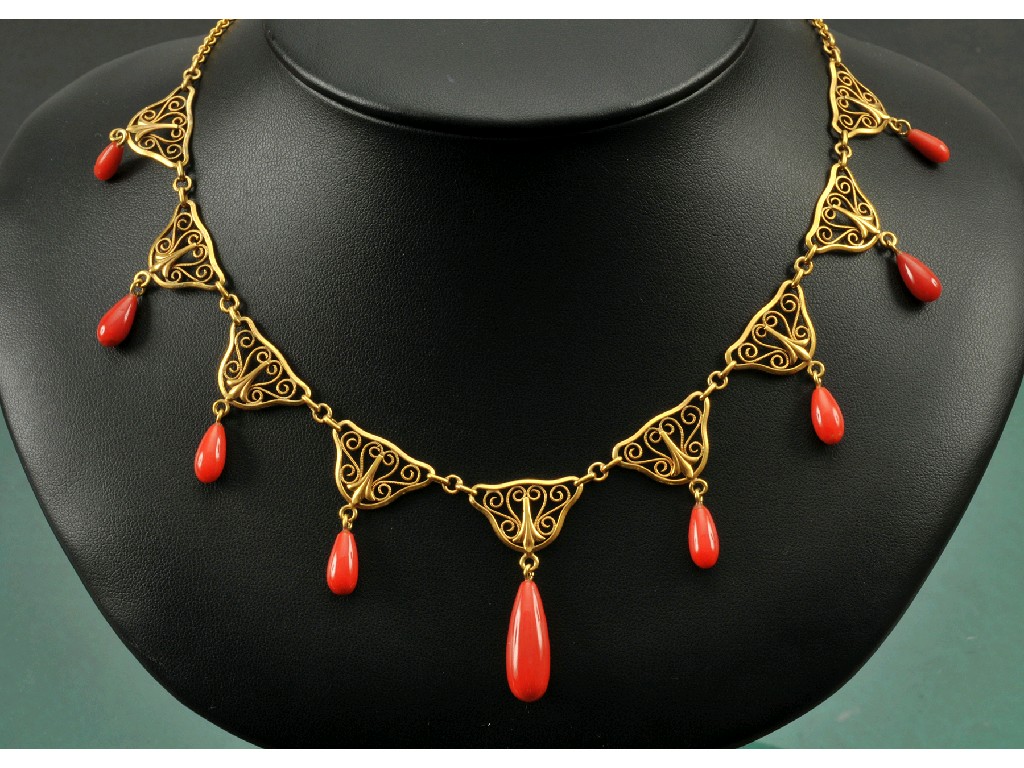 Appraisal: A Continental Coral Fringe Necklace the front with nine scrolled