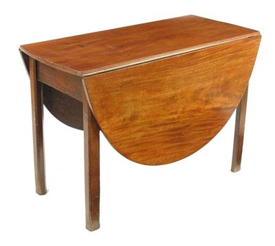 Appraisal: A George III mahogany drop-leaf table the oval top on