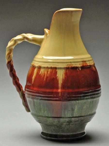 Appraisal: Fulper Rope Handled Pitcher Description Impressed Fulper mark Cream mahogany