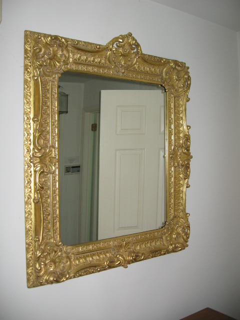 Appraisal: Molded gilt decorated mirror The rectangular plate marked at the