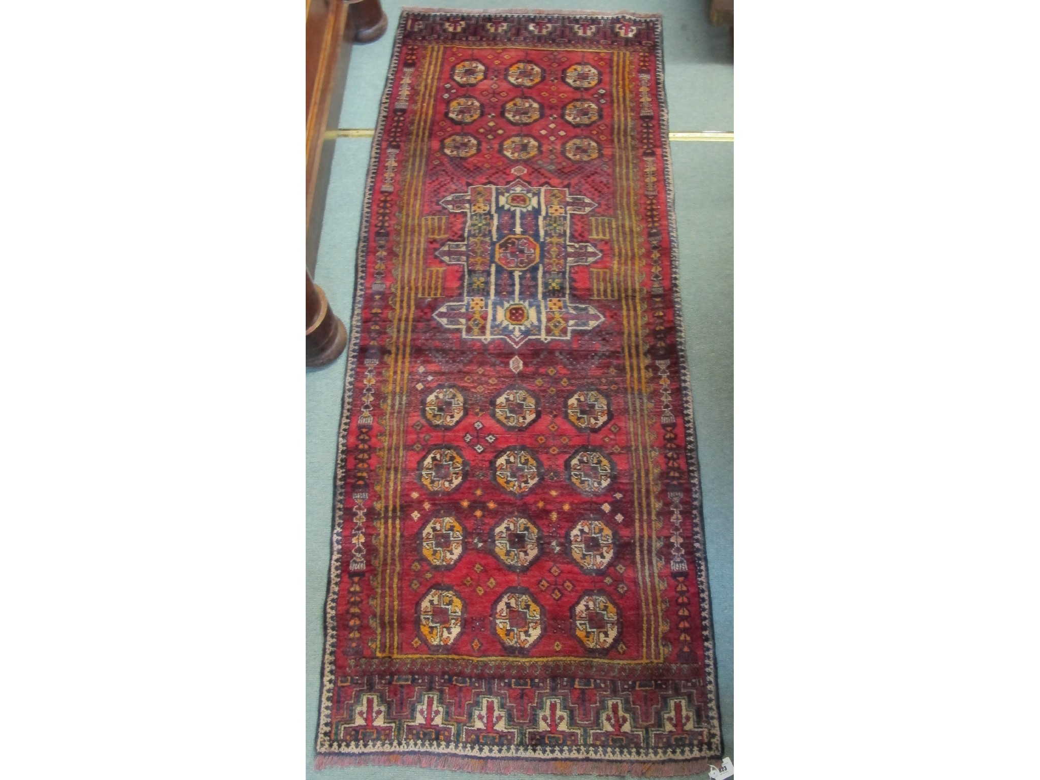 Appraisal: A red ground Baluchi runner x cm