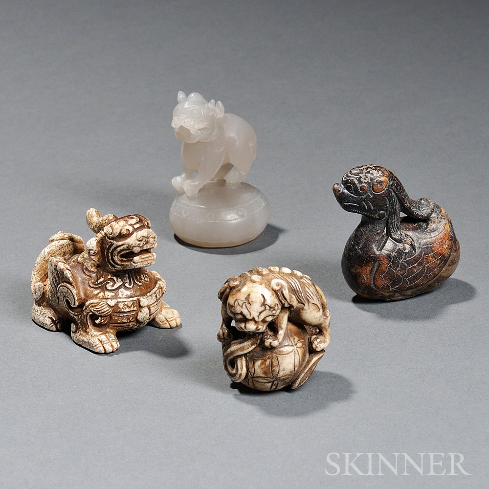 Appraisal: Four Stone Mythical Creatures China a Buddhist lion playing with