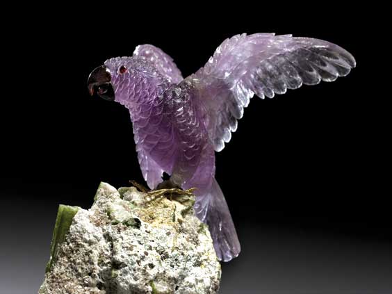 Appraisal: LARGE AMETHYST PARROT LANDING ON BASE OF LEPIDOLITE GREEN TOURMALINE