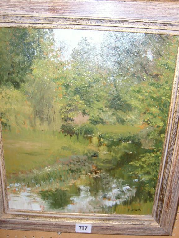 Appraisal: An oil painting on board of a river scene signed