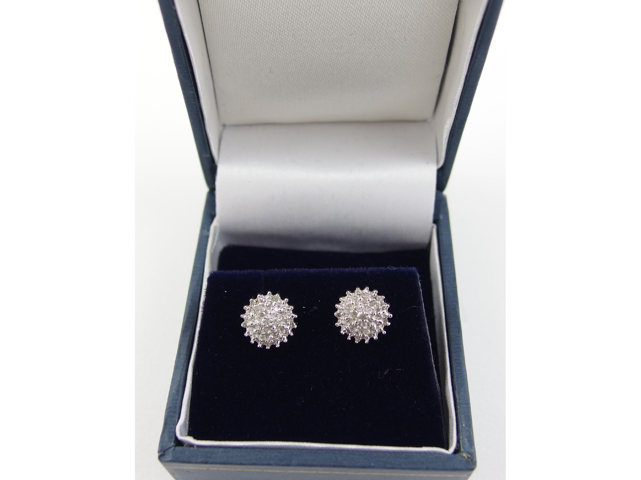 Appraisal: A pair of ct bicolour gold and diamond cluster stud