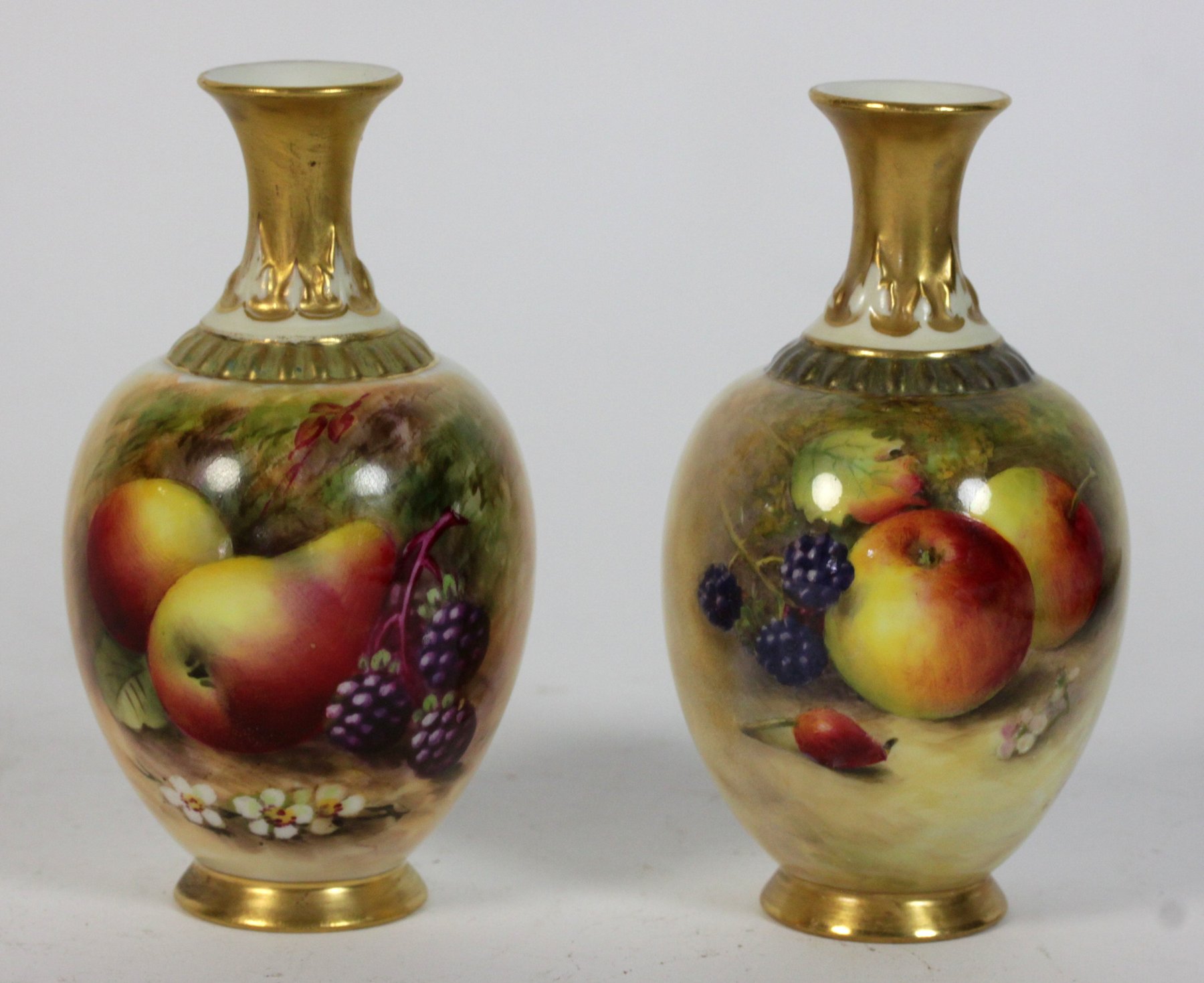 Appraisal: A pair of Royal Worcester vases painted apples and blackberries