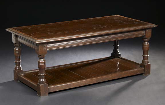 Appraisal: English Oak Coffee Table the rectangular top banded with a