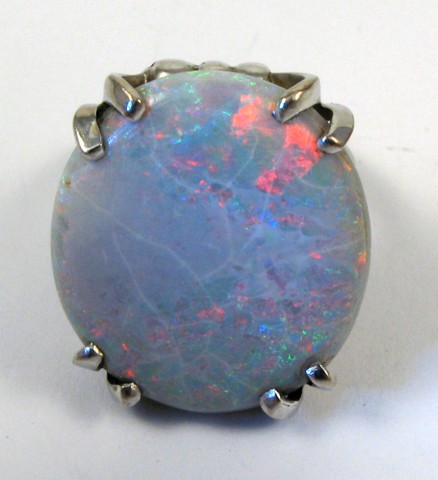 Appraisal: OPAL AND FOURTEEN KARAT GOLD RING set with a single