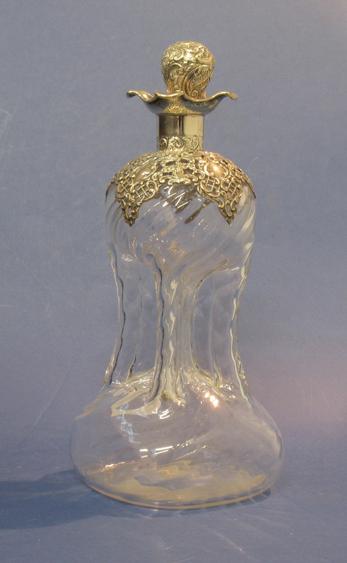 Appraisal: A LATE VICTORIAN KLUCK KLUCK DECANTER with a silver collar