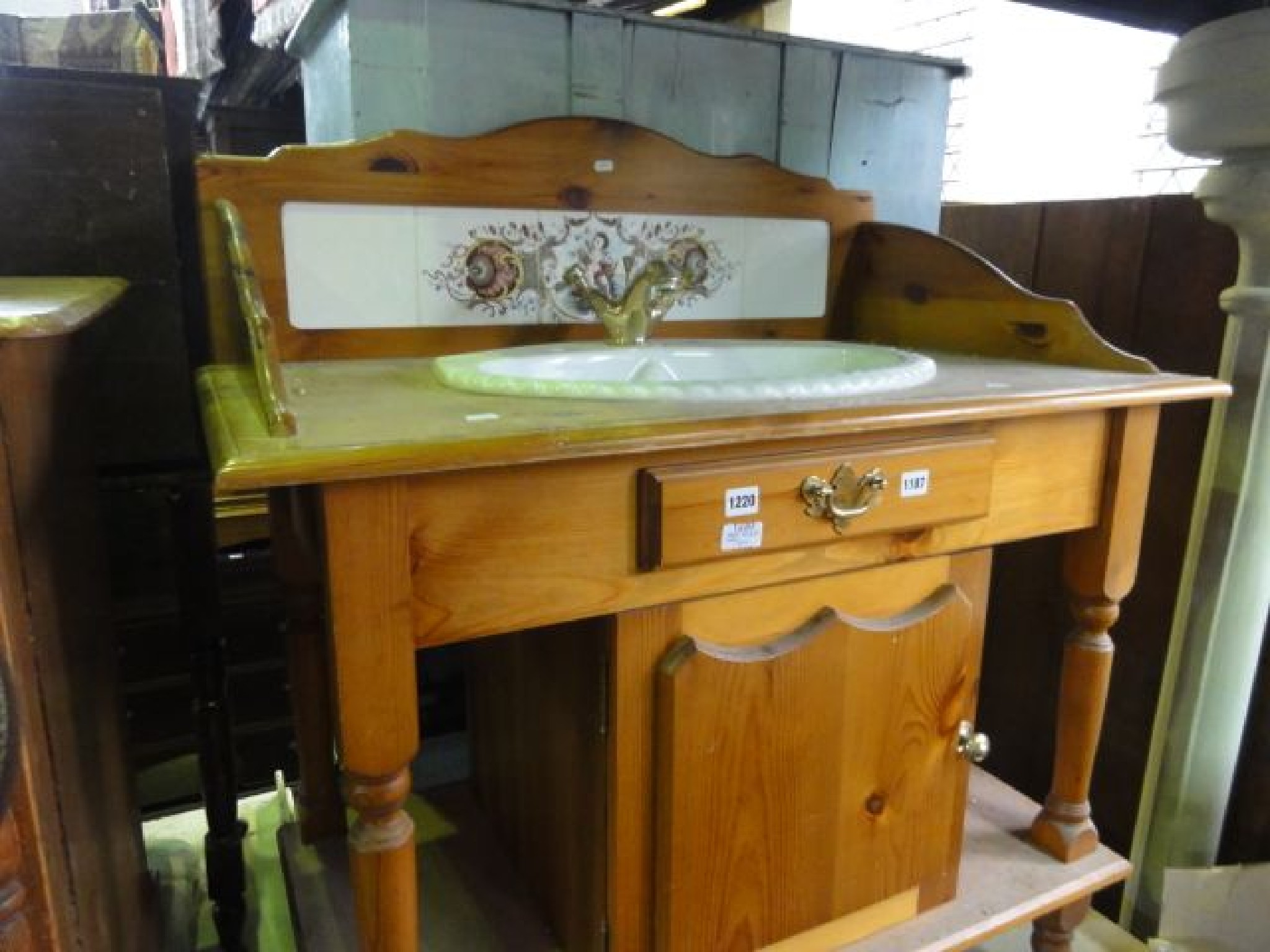 Appraisal: A Victorian style stripped pine washstand with tiled splashback ceramic