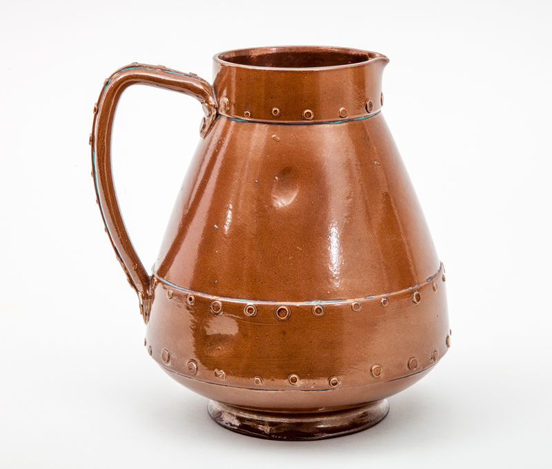 Appraisal: DOULTON LAMBETH SILICON SIMULATED HAND WROUGHT COPPER JUG Stoneware impressed