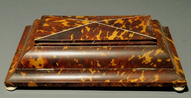 Appraisal: Tortoiseshell and mahogany inkstand c with ivory ball feet h