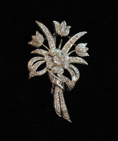 Appraisal: A DIAMOND OPEN-WORK BROOCH in the form of a spray