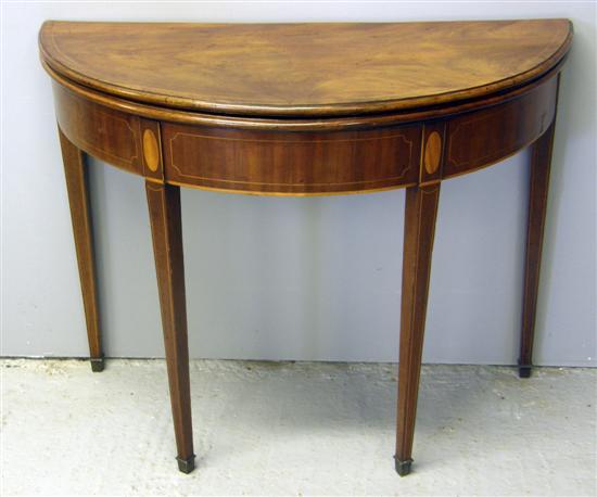 Appraisal: th century mahogany and line inlaid folding tea table on