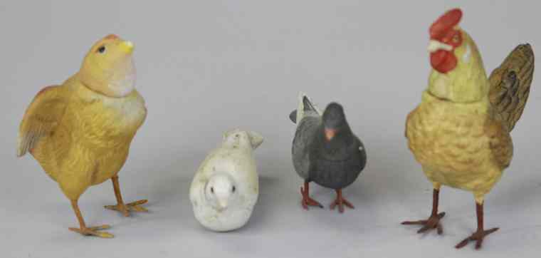 Appraisal: FOUR COMPOSITION BIRD CANDY CONTAINERS Germany includes grey white pigeon