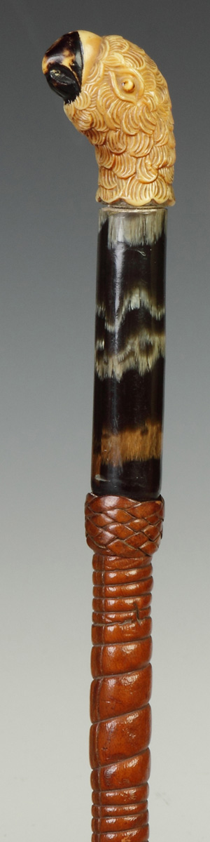 Appraisal: Cane with Carved Parrot Handle Leather horn w composition handle