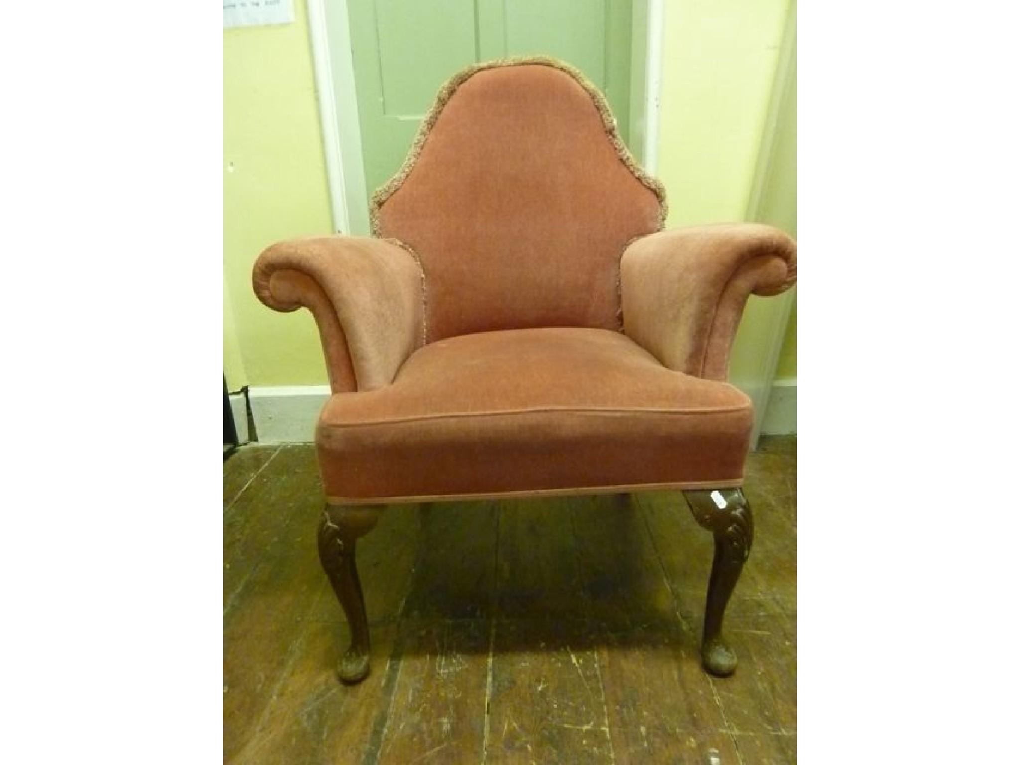 Appraisal: A pair of Georgian style armchairs with arched backs rolled