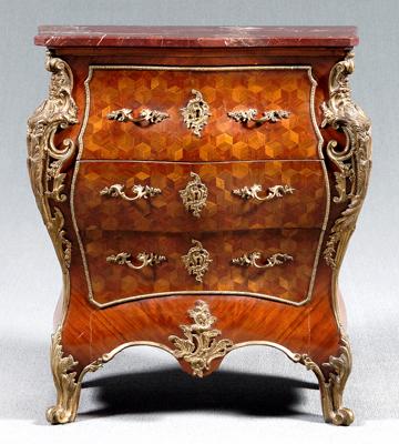 Appraisal: Louis XV style bomb eacute commode streaked red and ivory