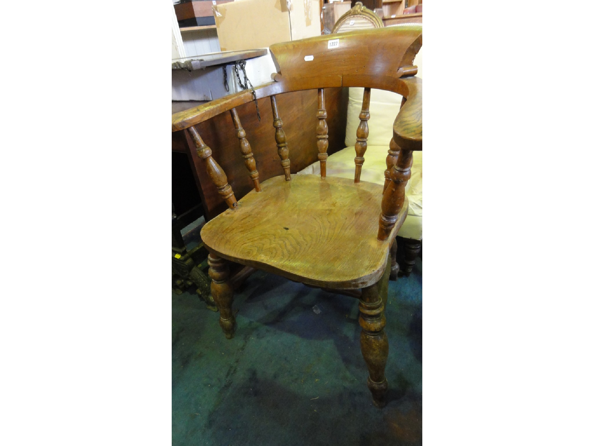 Appraisal: A Victorian smokers bow elbow chair principally in elm with