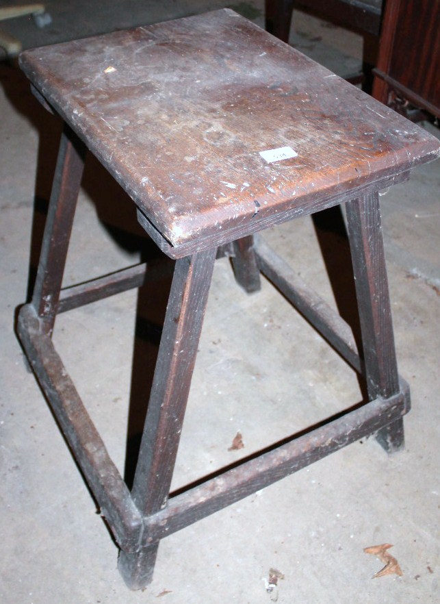 Appraisal: An oak stand with rectangular top on splayed legs and