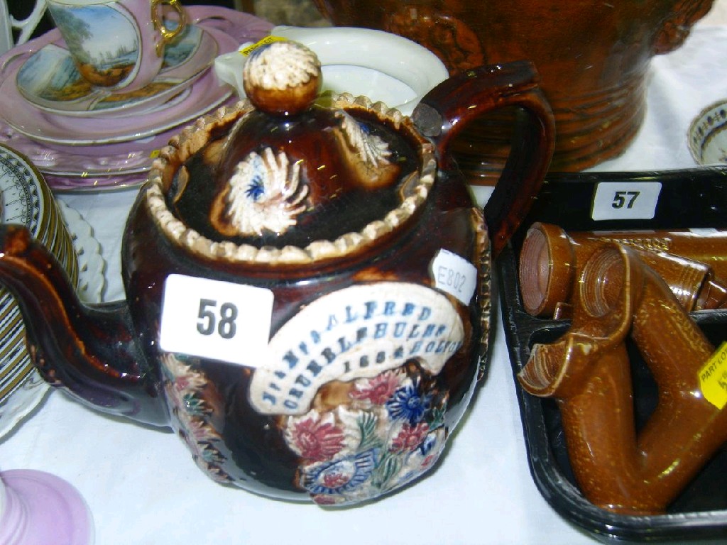 Appraisal: A Victorian Barge ware teapot with relief moulded floral decoration