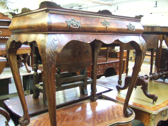 Appraisal: A George III style walnut silver table the shaped tray