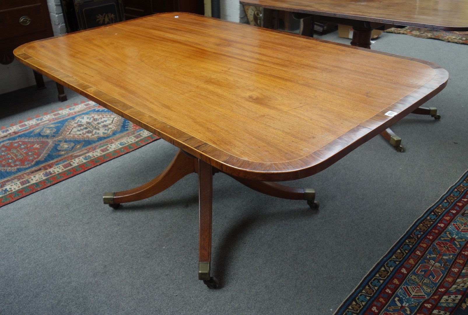 Appraisal: A George III rosewood banded mahogany breakfast table with rectangular