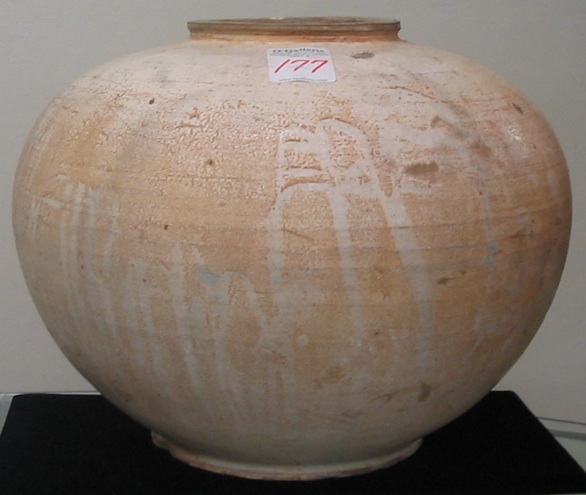 Appraisal: A DECORATIVE CHINESE EARTHENWARE POT having an off white slip