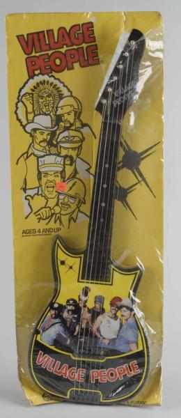 Appraisal: Vintage Carnival Toys Village People Guitar Toy Description American Marked