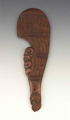 Appraisal: A Maori hand club wahaika the carved sickle shape blade