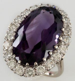 Appraisal: A K DIAMOND AND AMETHYST FASHION RING An oval cut