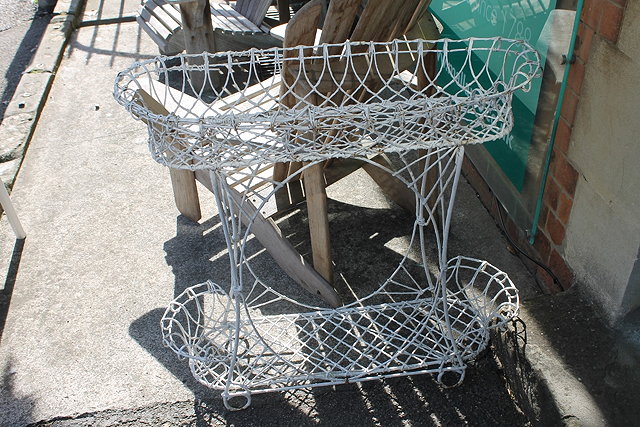 Appraisal: A VICTORIAN WIREWORK PLANTER of two tier oval form with