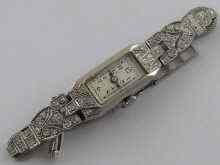 Appraisal: A white metal tests platinum and diamond lady's watch with