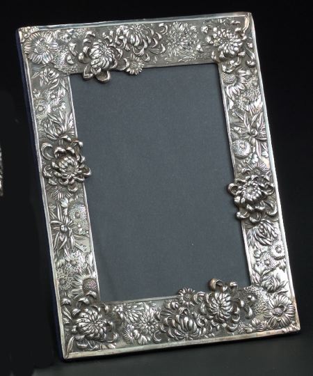 Appraisal: English Embossed Sterling Silver-Faced Photograph Frame in Chrysanthemum decor in